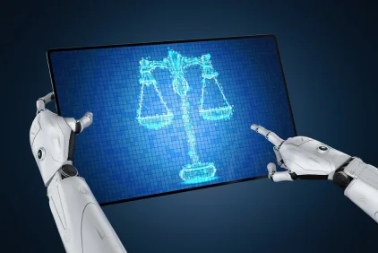 Robotic hand presenting scales of justice on a screen