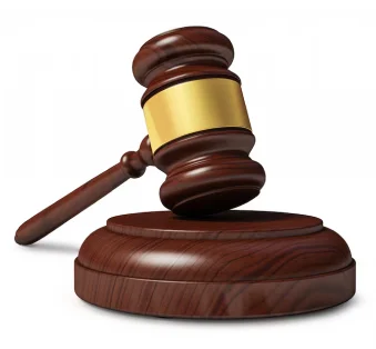 Wooden gavel on a sounding block