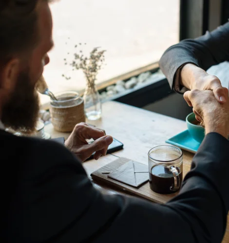 Handshake over a work table