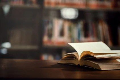 Open book on a desk in a library